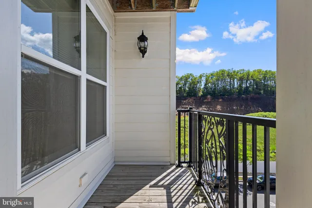 a view of a balcony with wooden floor