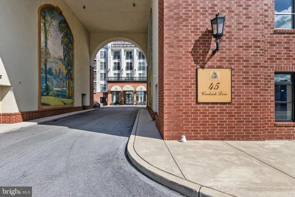 a view of a brick building with a porch