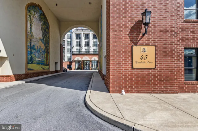 a view of a brick building with a porch