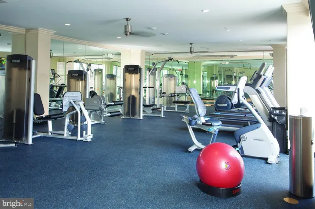 an outdoor room with table and chairs
