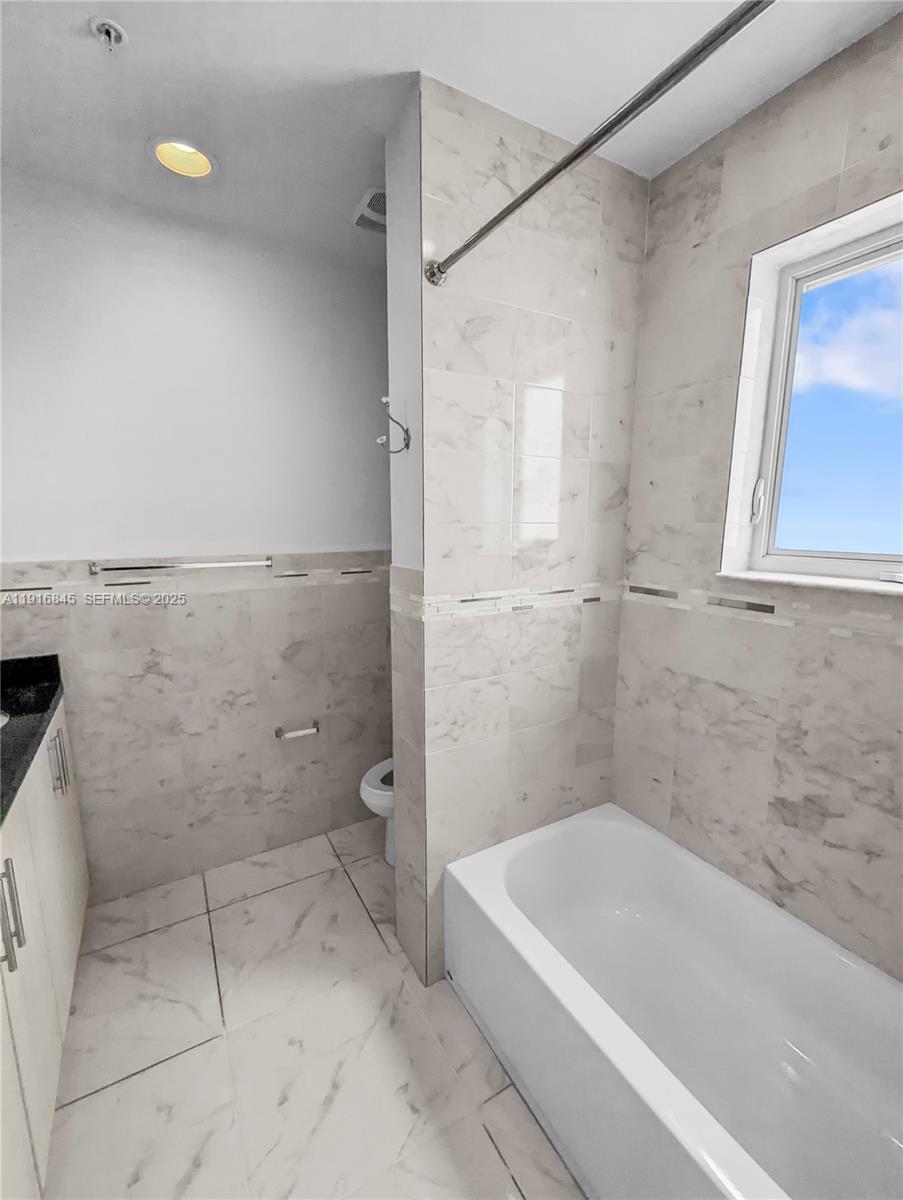 850 Southwest 14th Avenue, Unit 4 Miami, FL 33135 - Photo 14 of 30 a bathroom with a shower and a bathtub