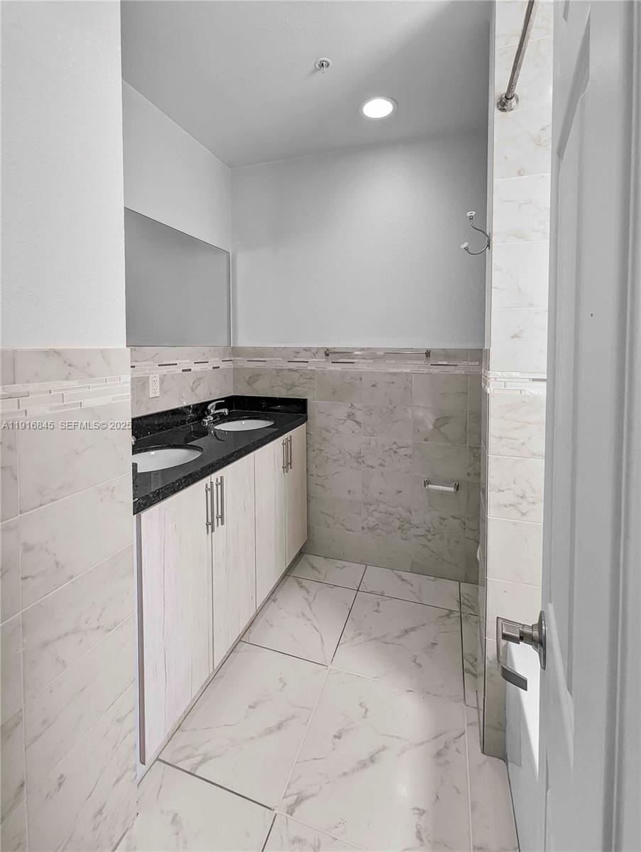 850 Southwest 14th Avenue, Unit 4 Miami, FL 33135 - Photo 16 of 30 a kitchen with a sink and cabinets