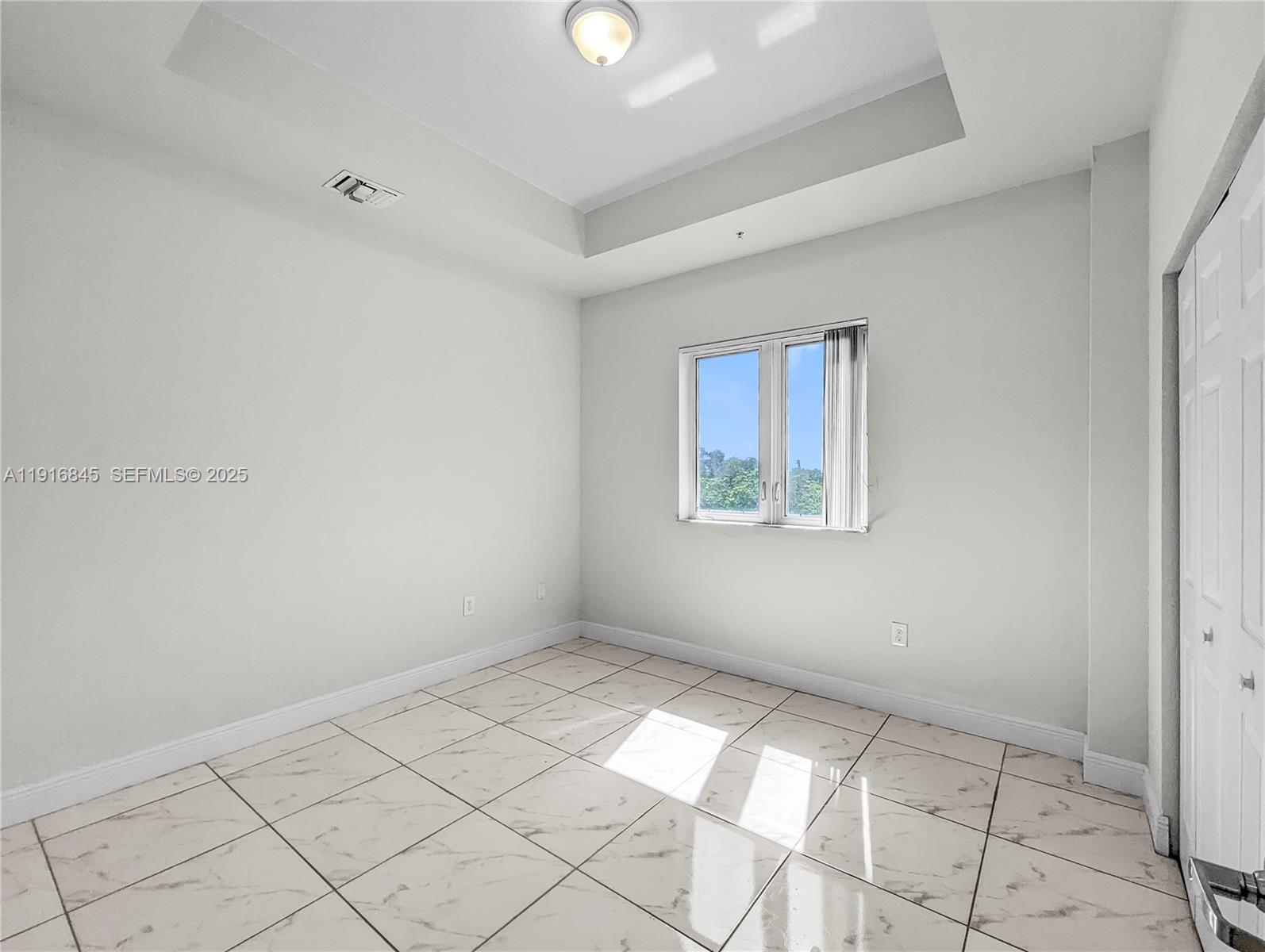850 Southwest 14th Avenue, Unit 4 Miami, FL 33135 - Photo 22 of 30 an empty room with windows