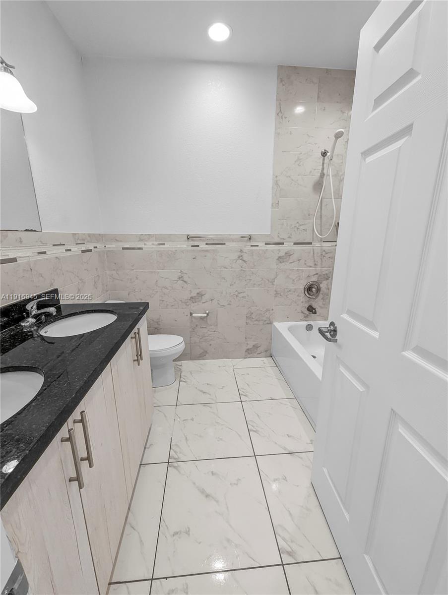 850 Southwest 14th Avenue, Unit 4 Miami, FL 33135 - Photo 23 of 30 a bathroom with a sink and a toilet