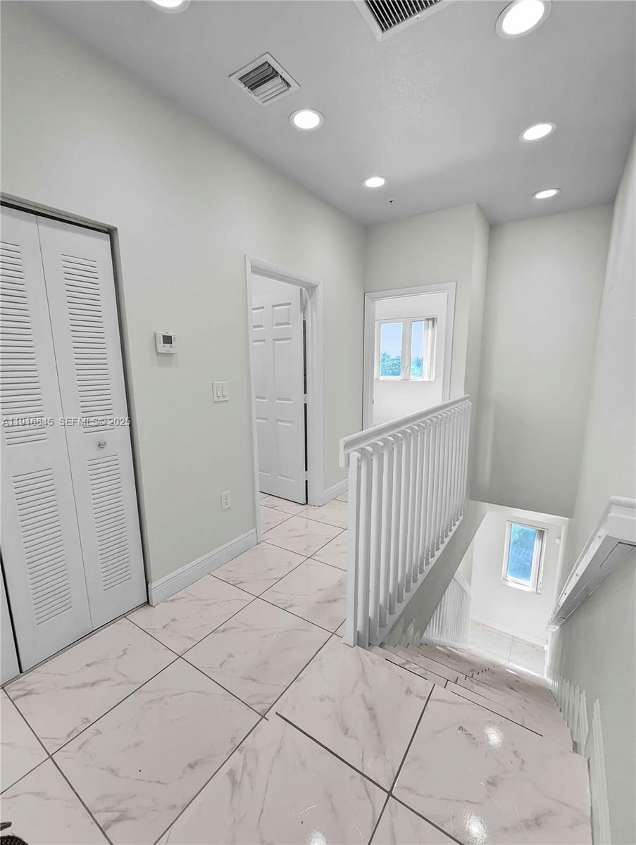 850 Southwest 14th Avenue, Unit 4 Miami, FL 33135 - Photo 25 of 30 a view of hallway with stairs and a window