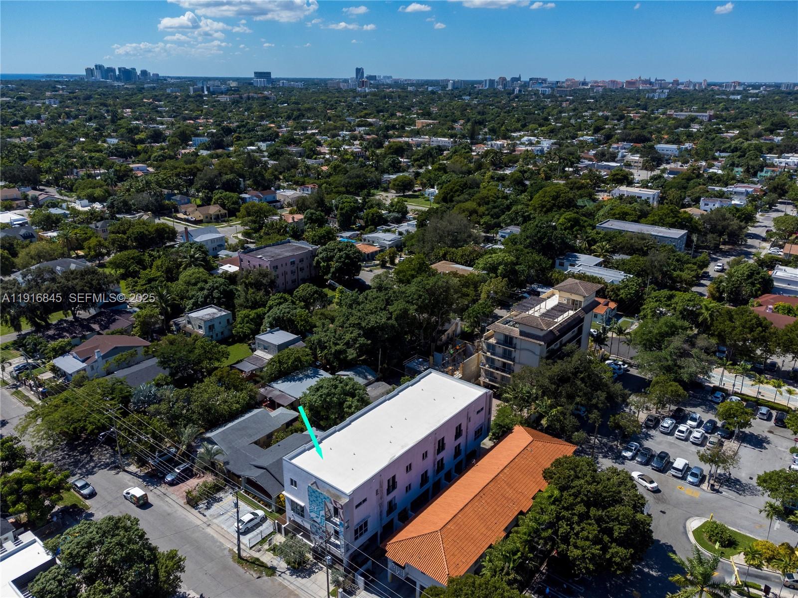 850 Southwest 14th Avenue, Unit 4 Miami, FL 33135 - Photo 26 of 30 an aerial view of a house with a yard and mountain view in back