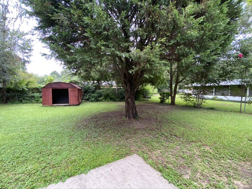 205 Powell Drive Crestview, FL 32536 - Photo 12 of 12 a big yard with lots of green space and plants