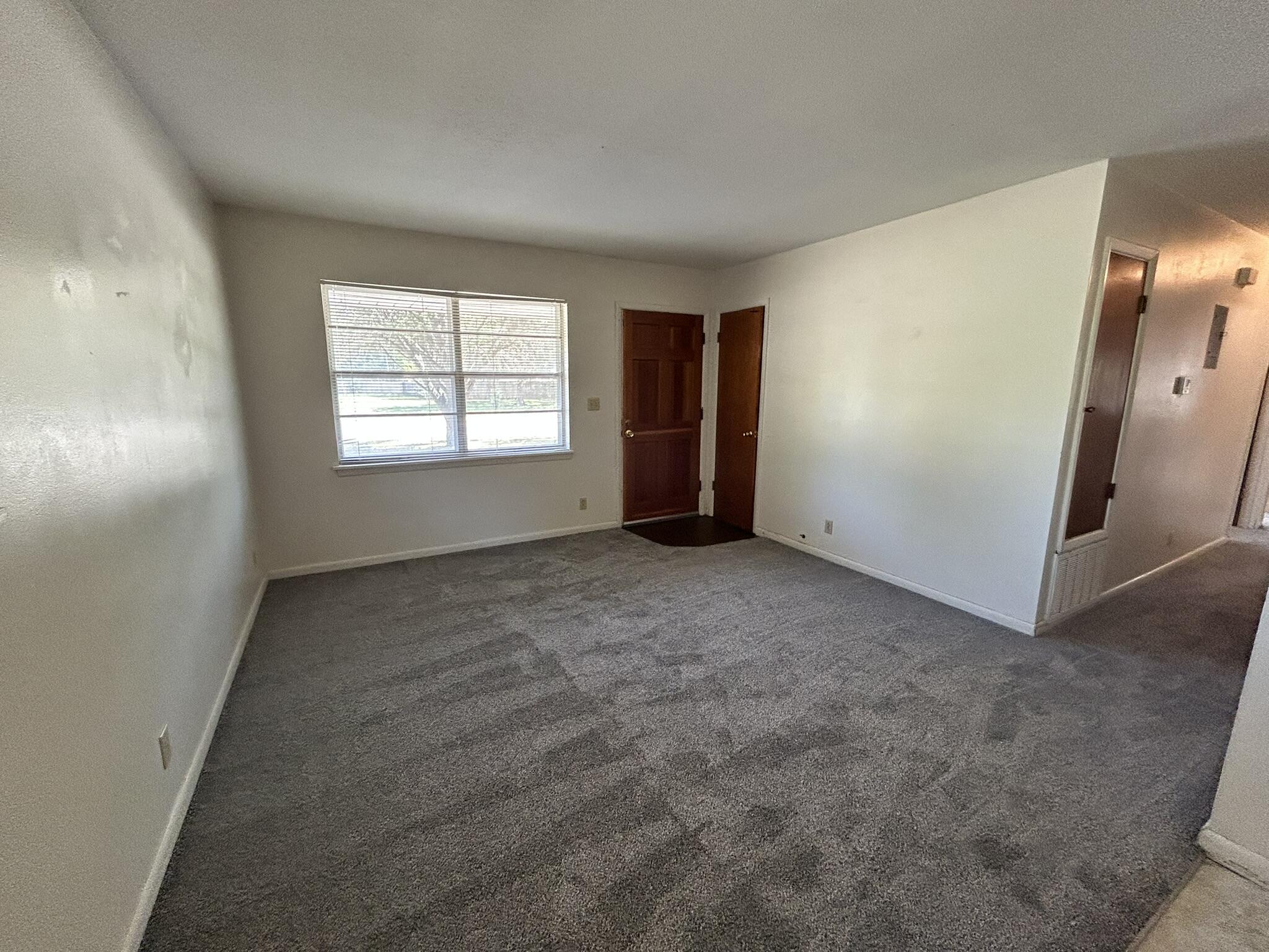 205 Powell Drive Crestview, FL 32536 - Photo 3 of 12 an empty room with windows