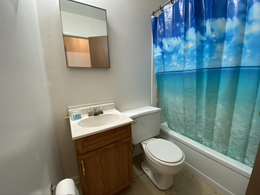 205 Powell Drive Crestview, FL 32536 - Photo 6 of 12 a bathroom with a toilet a sink and garden view