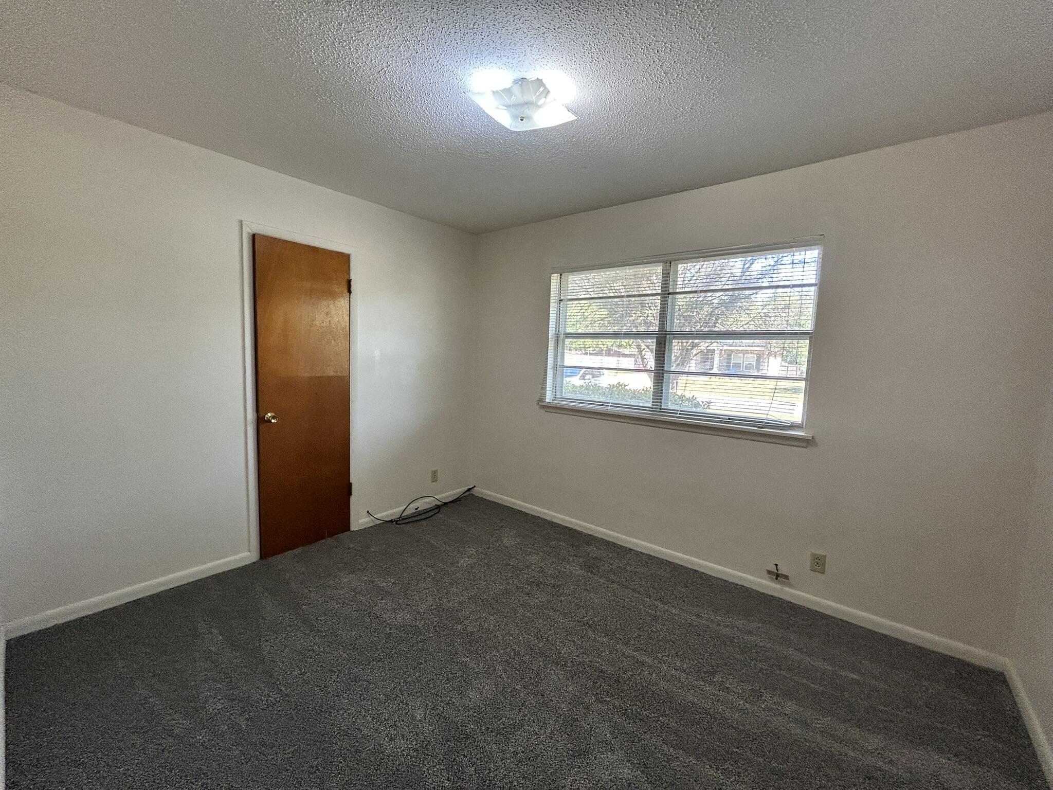 205 Powell Drive Crestview, FL 32536 - Photo 7 of 12 an empty room with windows