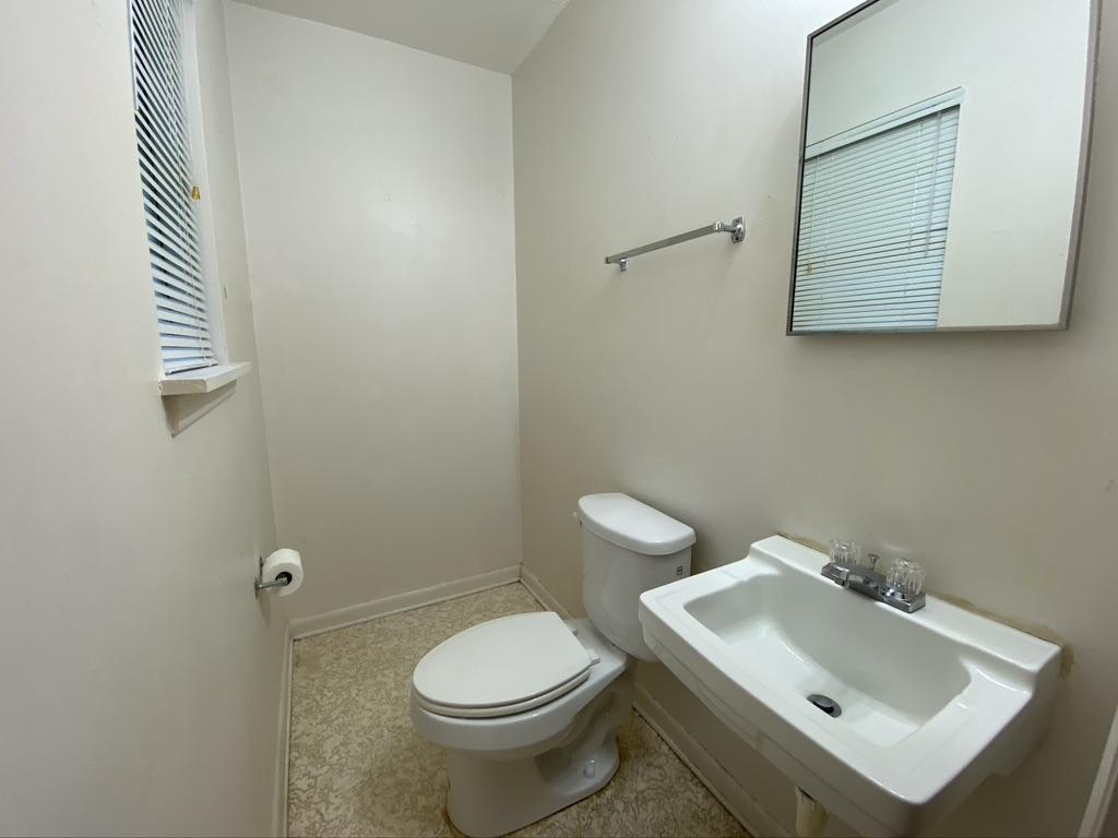 205 Powell Drive Crestview, FL 32536 - Photo 10 of 12 a bathroom with a sink mirror and toilet