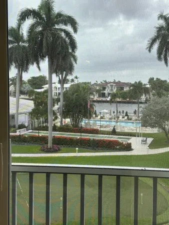 a view of a lake from a balcony with city view