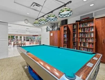 a room with window and pool