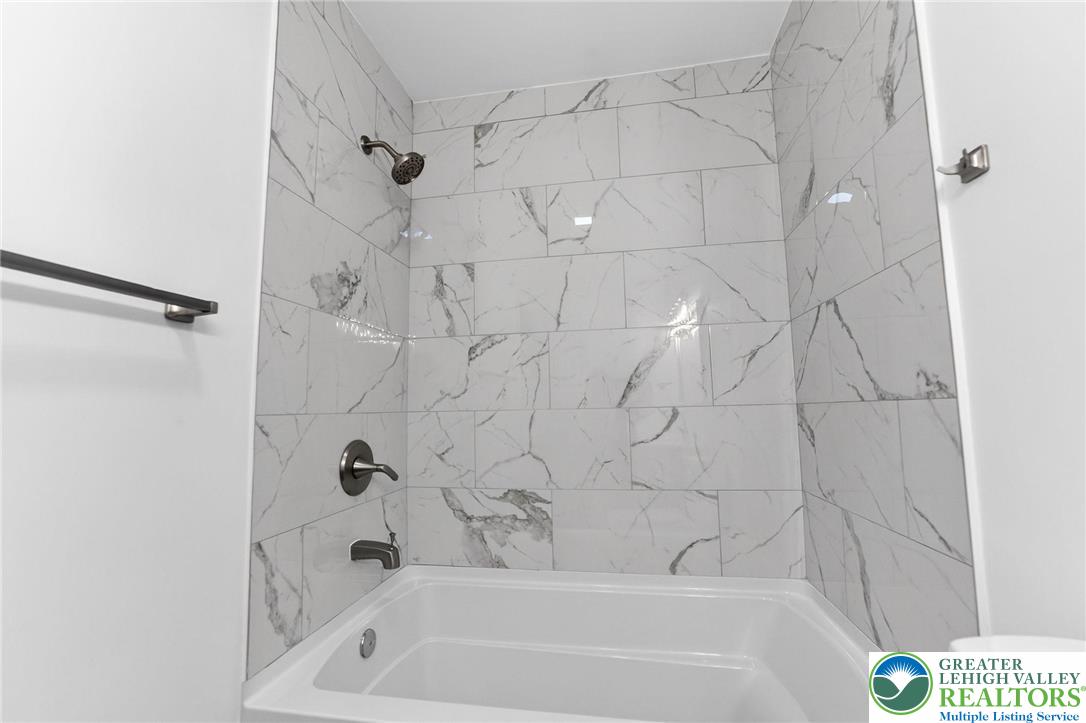 708 Cherokee Street Bethlehem, PA 18015 - Photo 16 of 25 a bathroom with a shower and bathtub