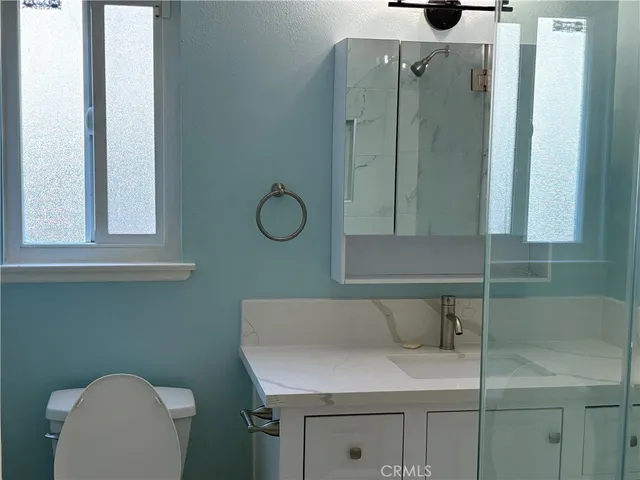 a bathroom with a sink and mirror