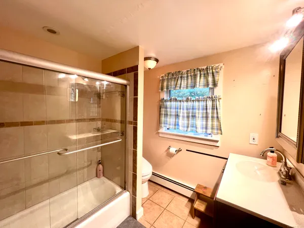 a bathroom with a tub and a sink