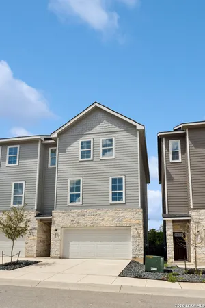 a front view of a house with a garden and entryway