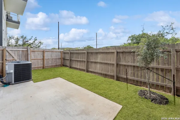 a view of a backyard with a garden and plants