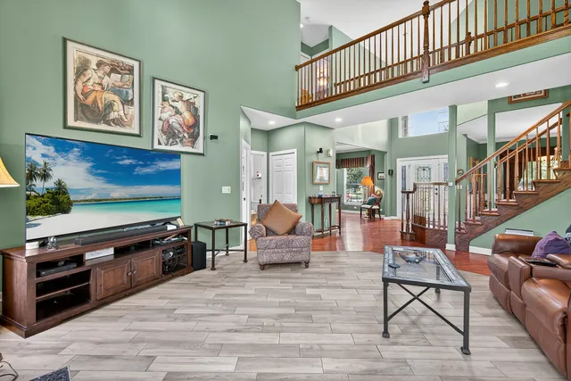 a bedroom with furniture and wooden floor