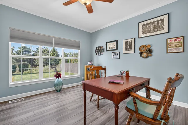 a workspace with furniture and window