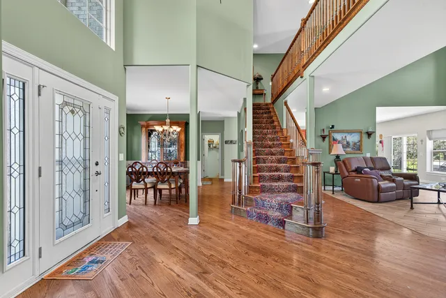 a view of a livingroom with furniture and an entryway