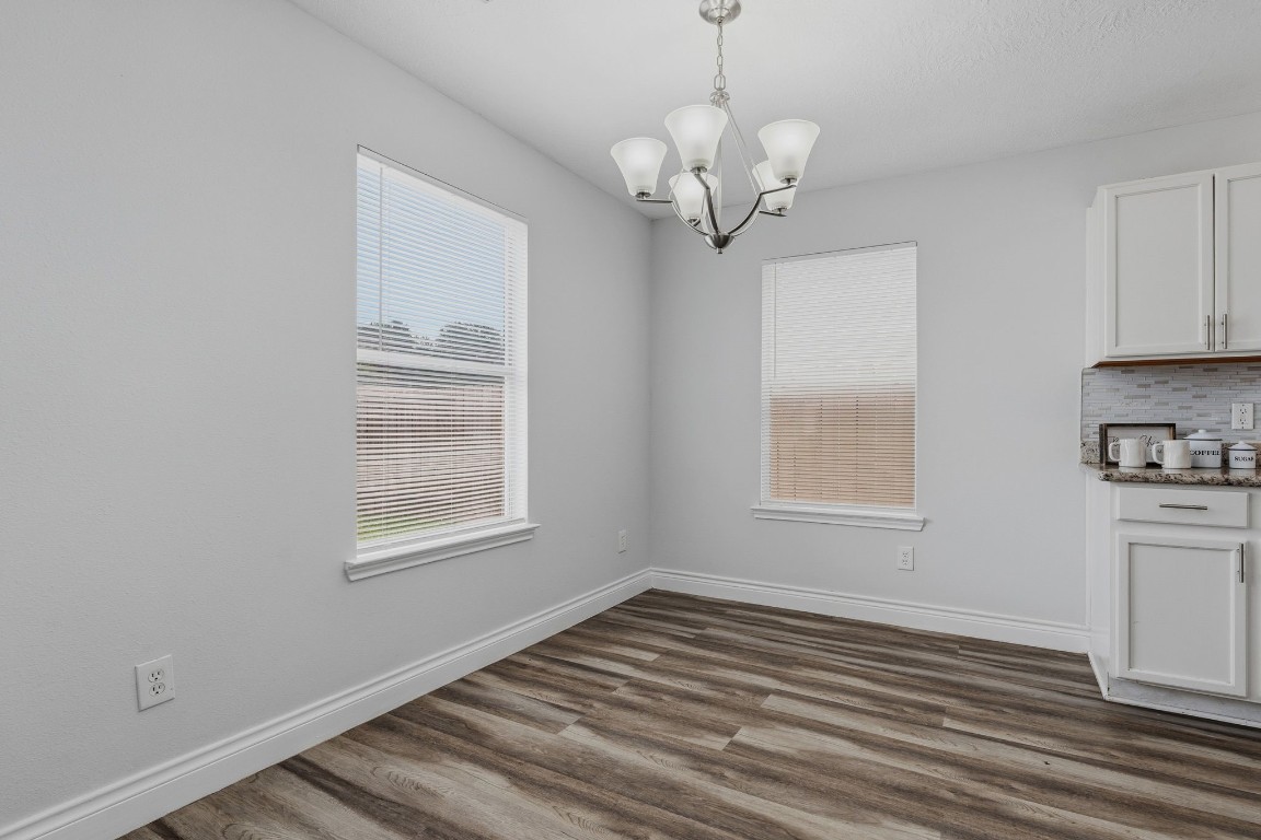 1427 Hade Falls Lane Houston, TX 77073 - Photo 13 of 31 Bright dining area with two large windows, perfectly situated just off the kitchen—ideal for entertaining or enjoying special family meals.