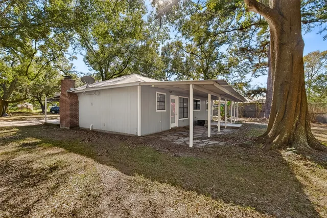 a house with trees in the background