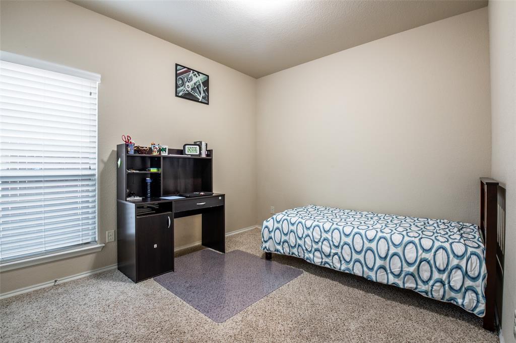 504 Rocky Pine Road McKinney, TX 75072 - Photo 28 of 36 Carpeted bedroom featuring baseboards