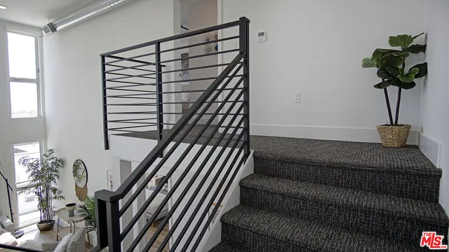 a vase of flowers sitting on a floor
