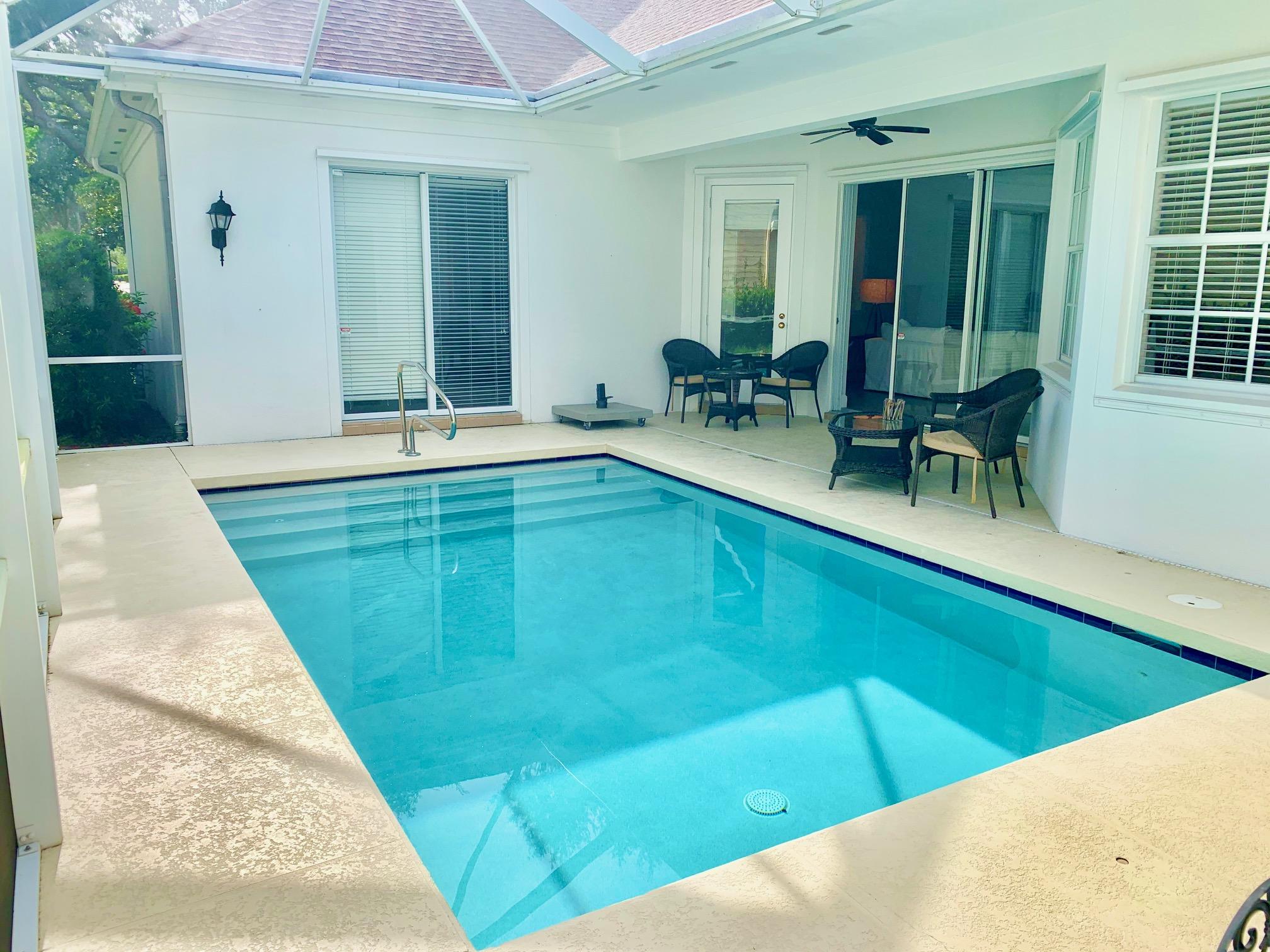 125 Date Palm Drive Jupiter, FL 33458 - Photo 3 of 24 Heated Screened Pool