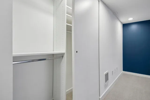 a view of an empty walk in closet