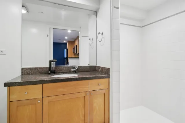 a bathroom with a sink and a mirror