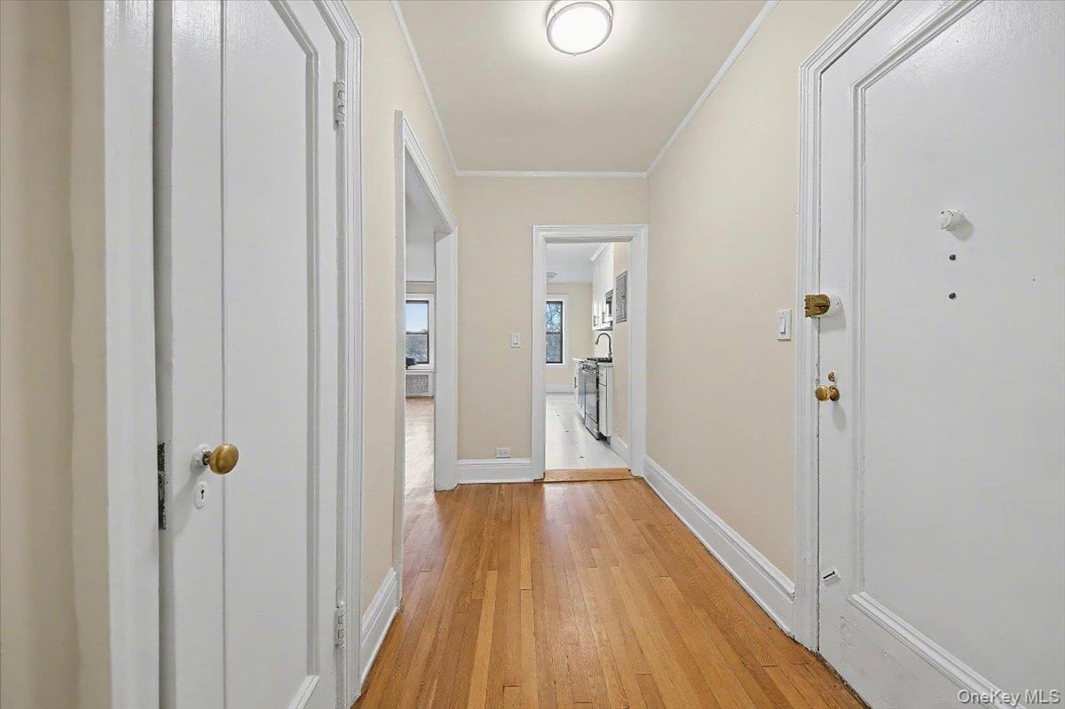 127 Garth Road, Unit 5D Scarsdale, NY 10583 - Photo 18 of 20 a view of a hallway with wooden floor