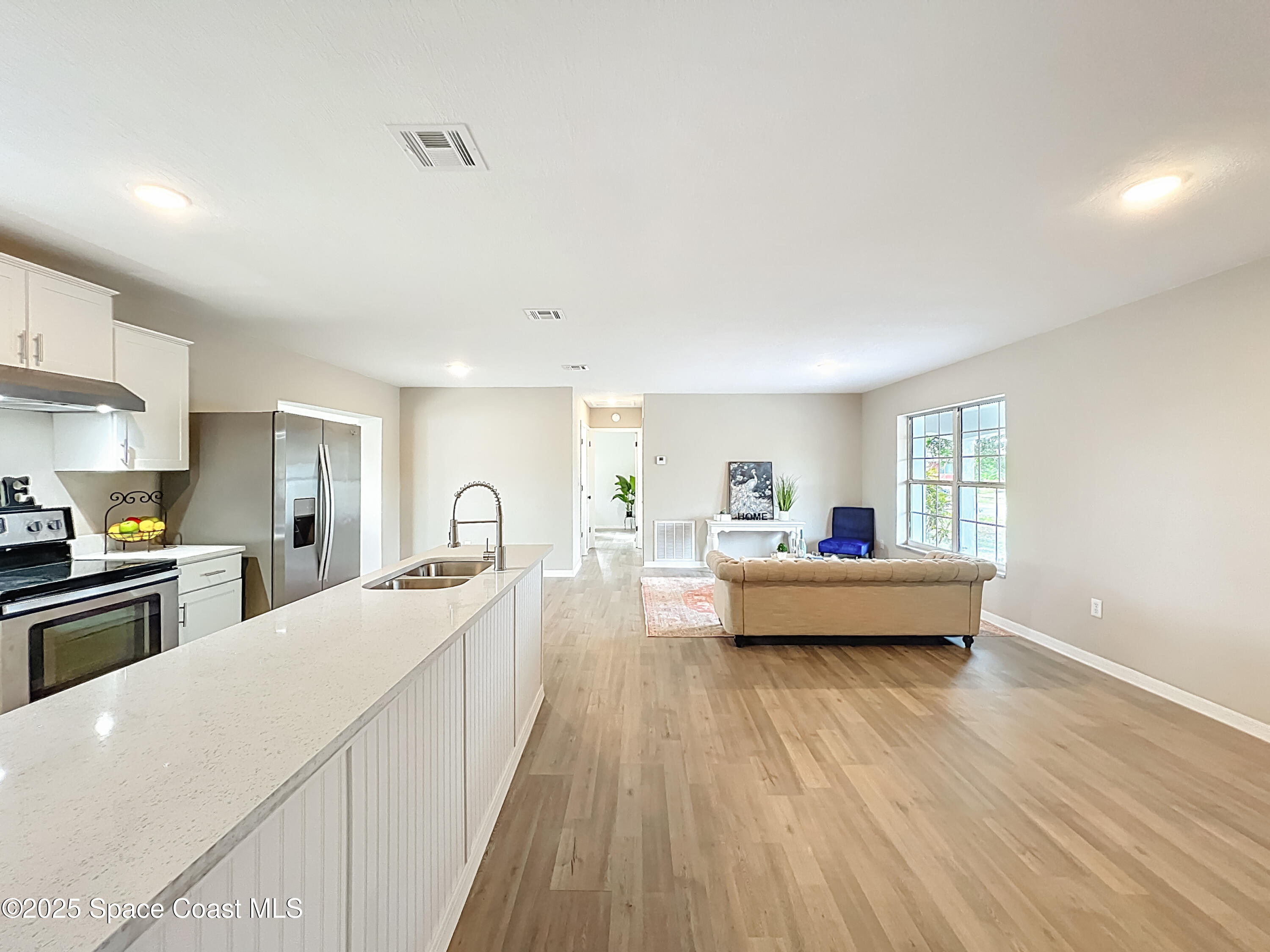 983 Vangi Lane Northeast Palm Bay, FL 32905 - Photo 14 of 35 Facing guest bedrooms