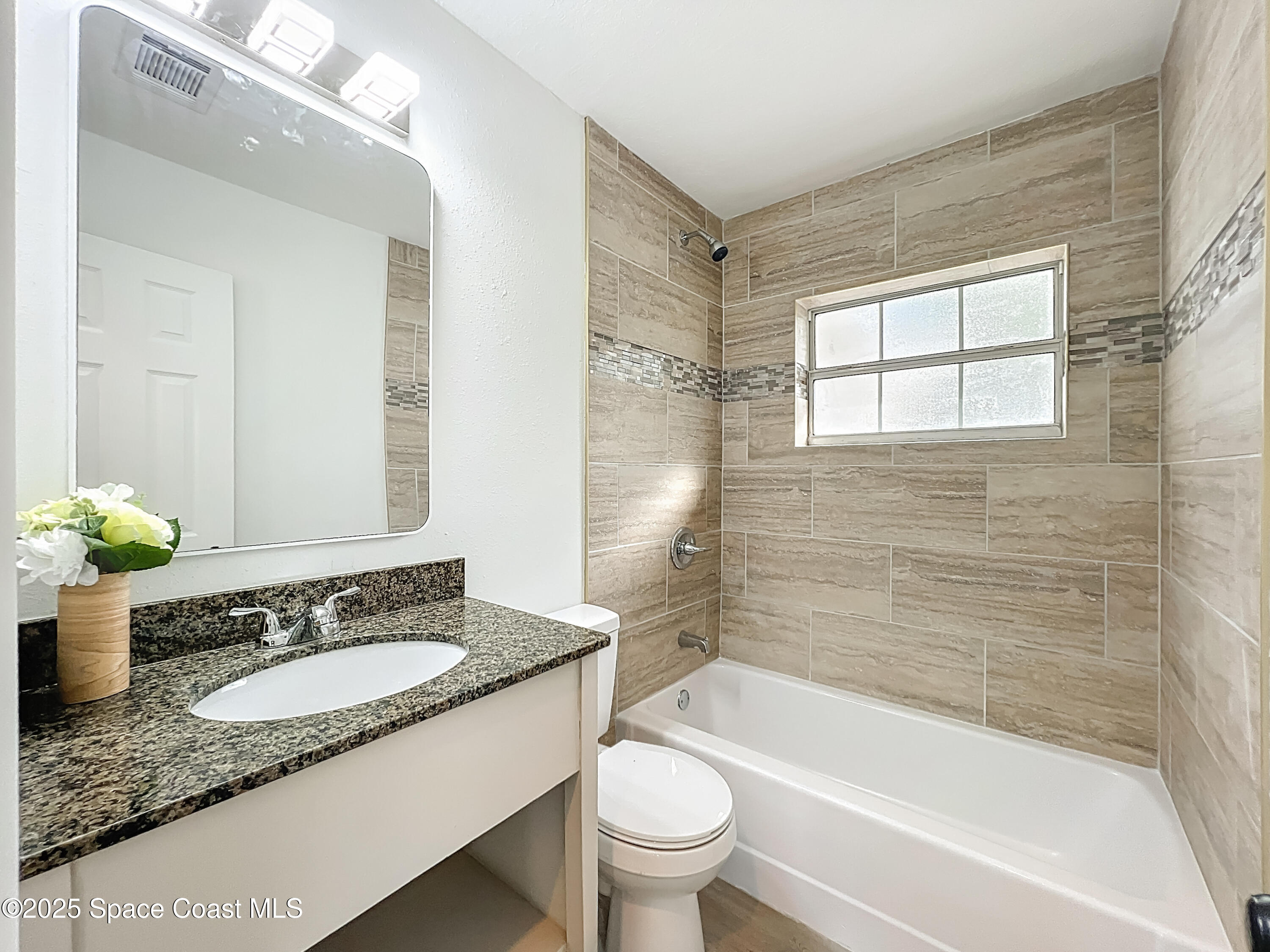 983 Vangi Lane Northeast Palm Bay, FL 32905 - Photo 32 of 35 Guest bathroom