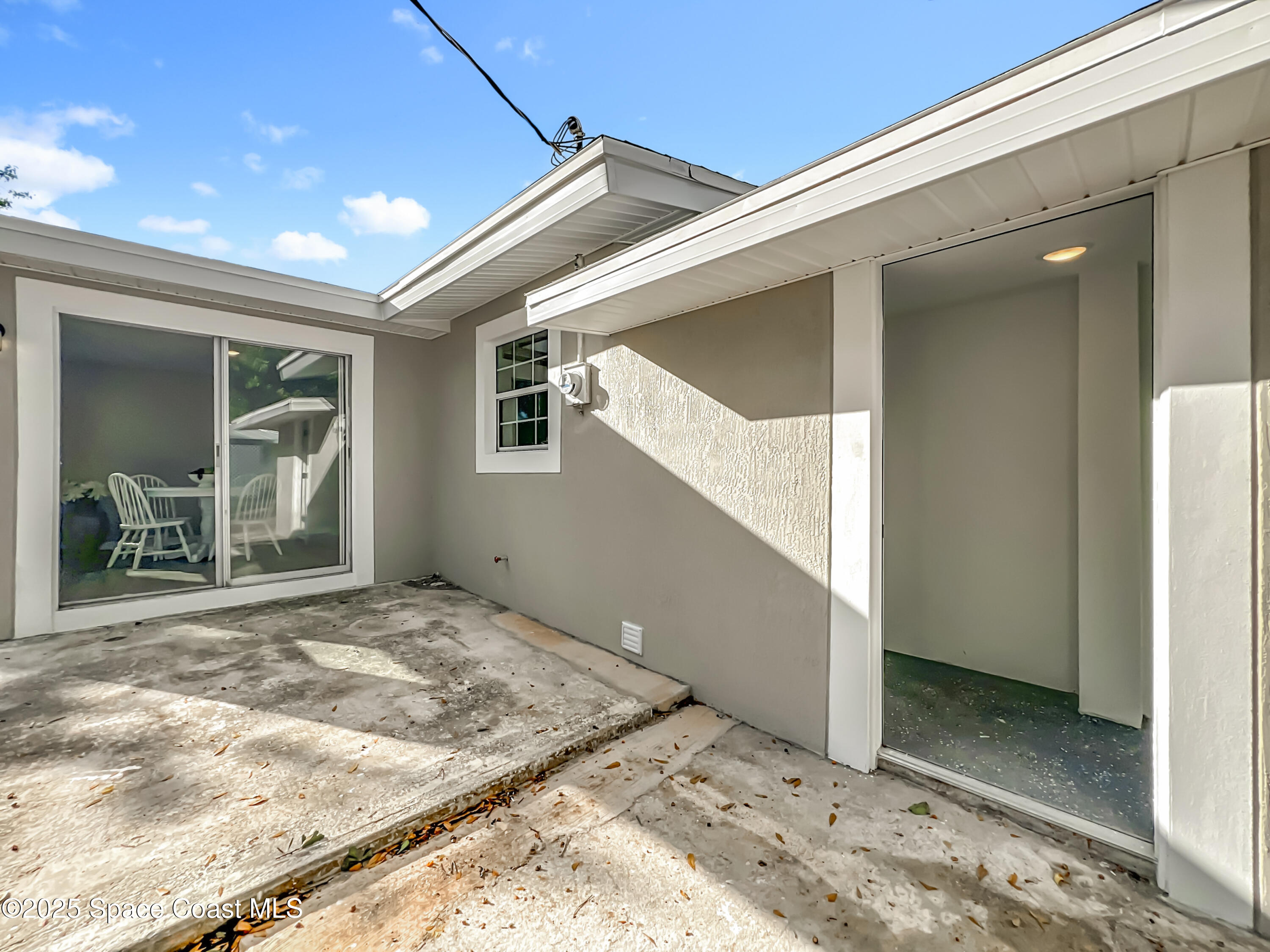983 Vangi Lane Northeast Palm Bay, FL 32905 - Photo 33 of 35 Back patio/laundry