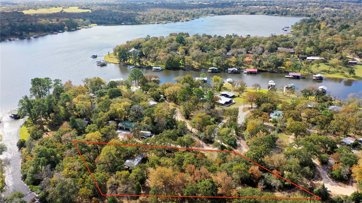 10232 Riley Green Road Franklin, TX 77856 - Photo 2 of 40 Aerial view of property and surrounding area with a large body of water and property boundaries highlighted