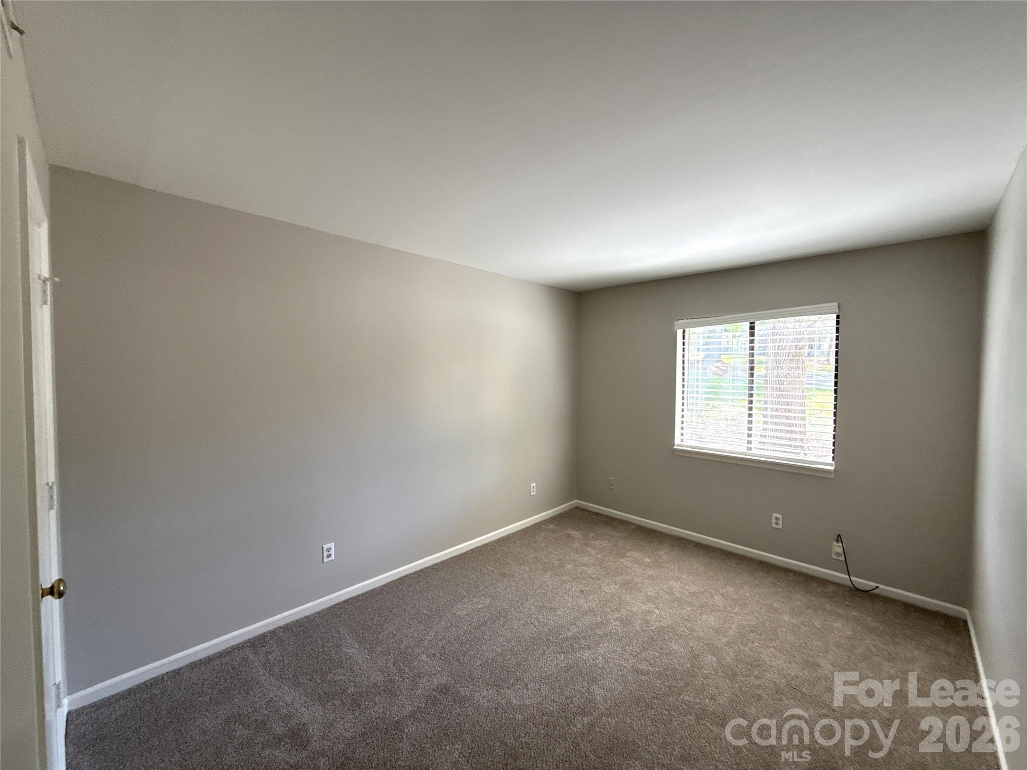 11002 Harrowfield Road Charlotte, NC 28226 - Photo 12 of 16 an empty room with a window