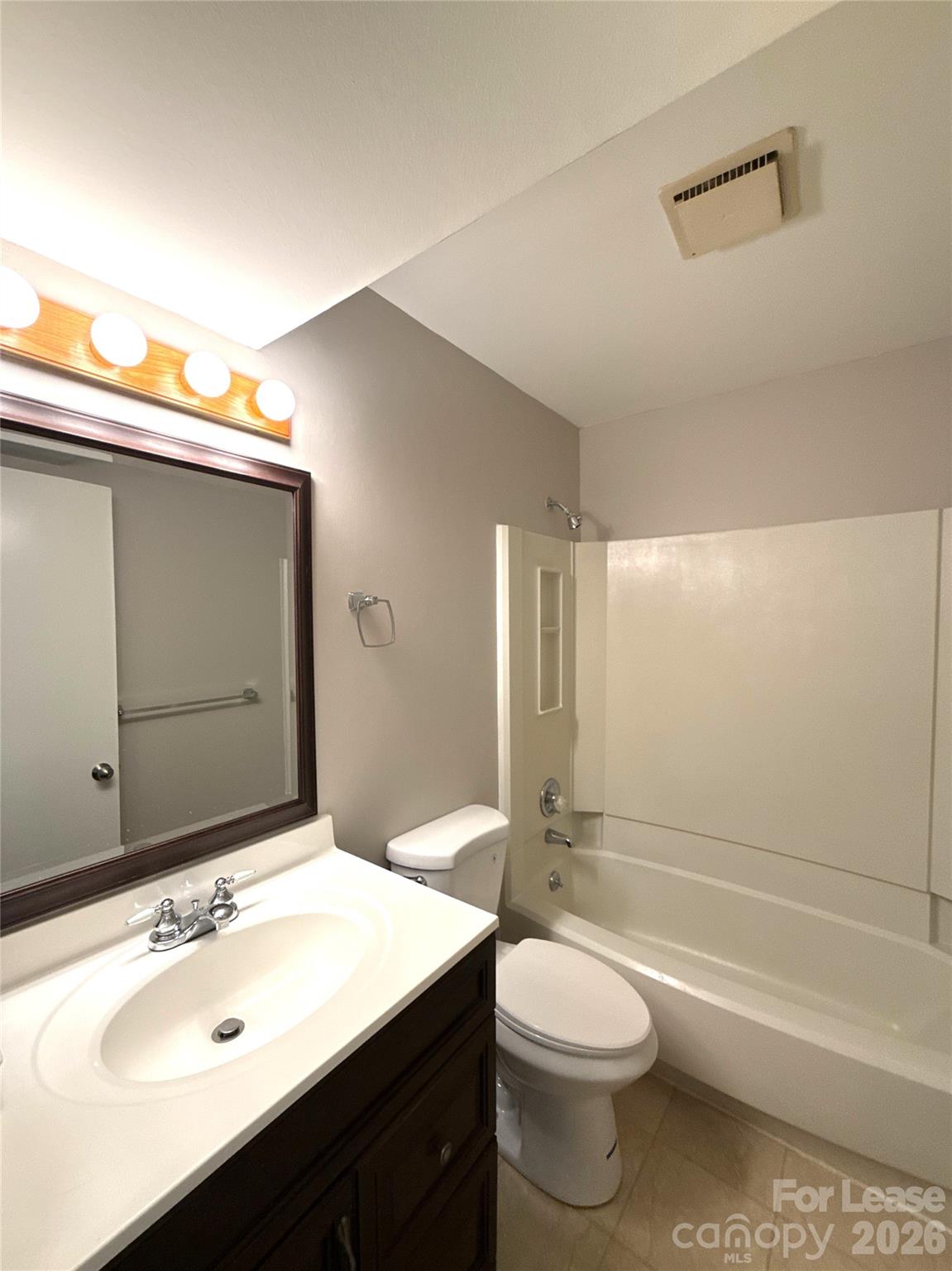 11002 Harrowfield Road Charlotte, NC 28226 - Photo 13 of 16 a bathroom with a sink a toilet and shower