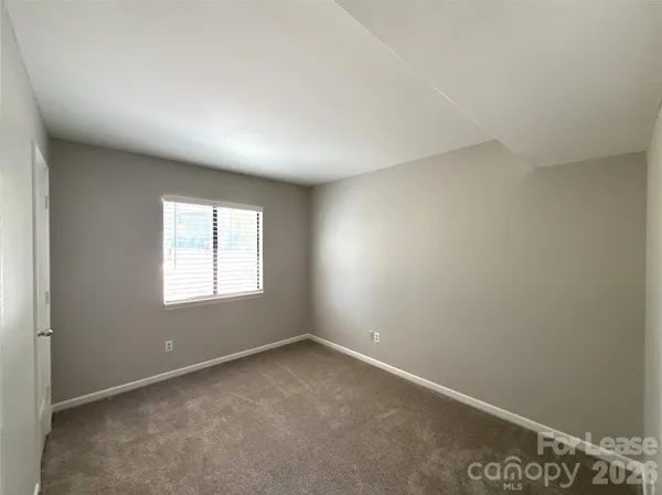 a view of porch with green trees