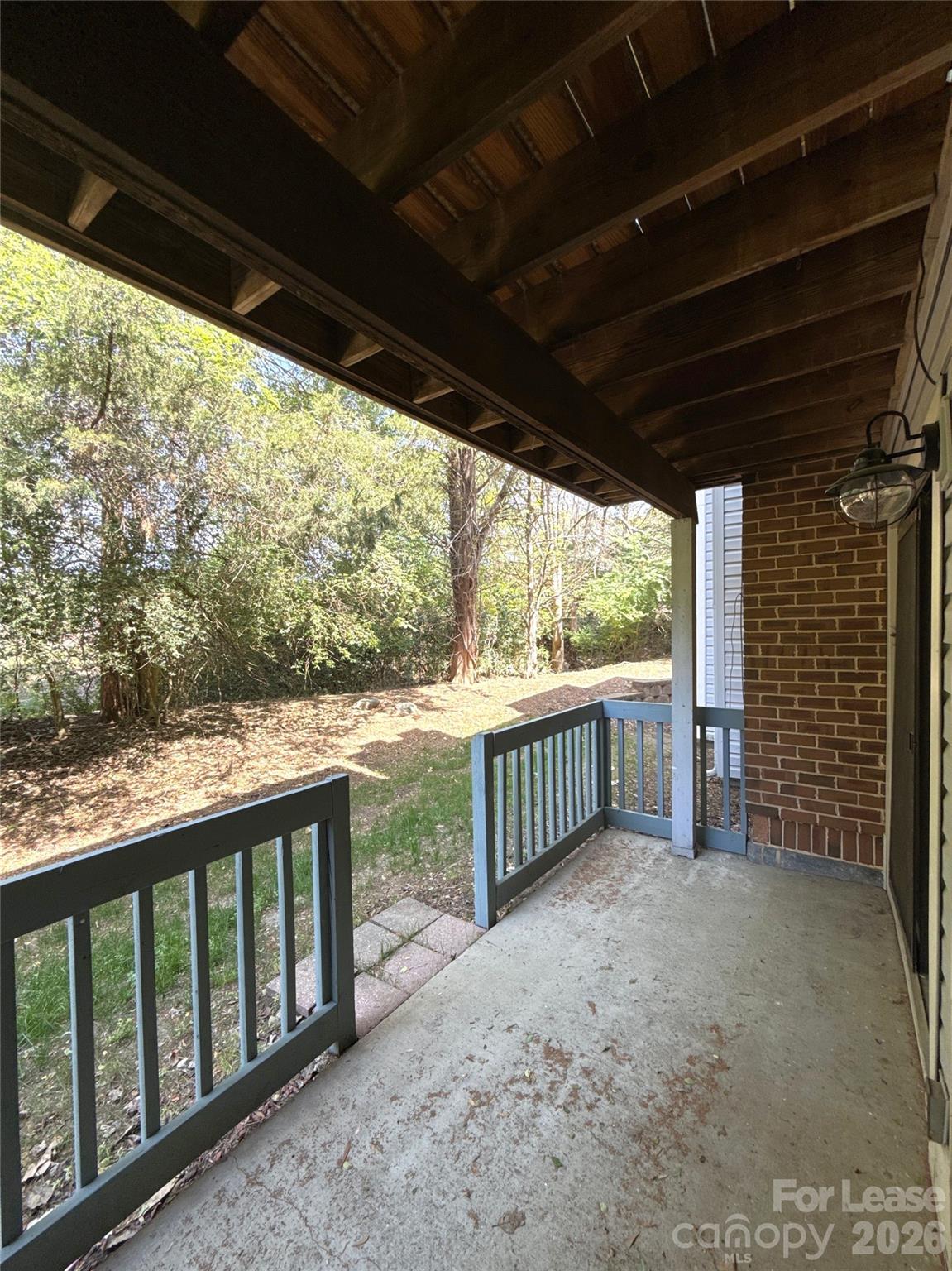 11002 Harrowfield Road Charlotte, NC 28226 - Photo 15 of 16 a view of porch with green trees