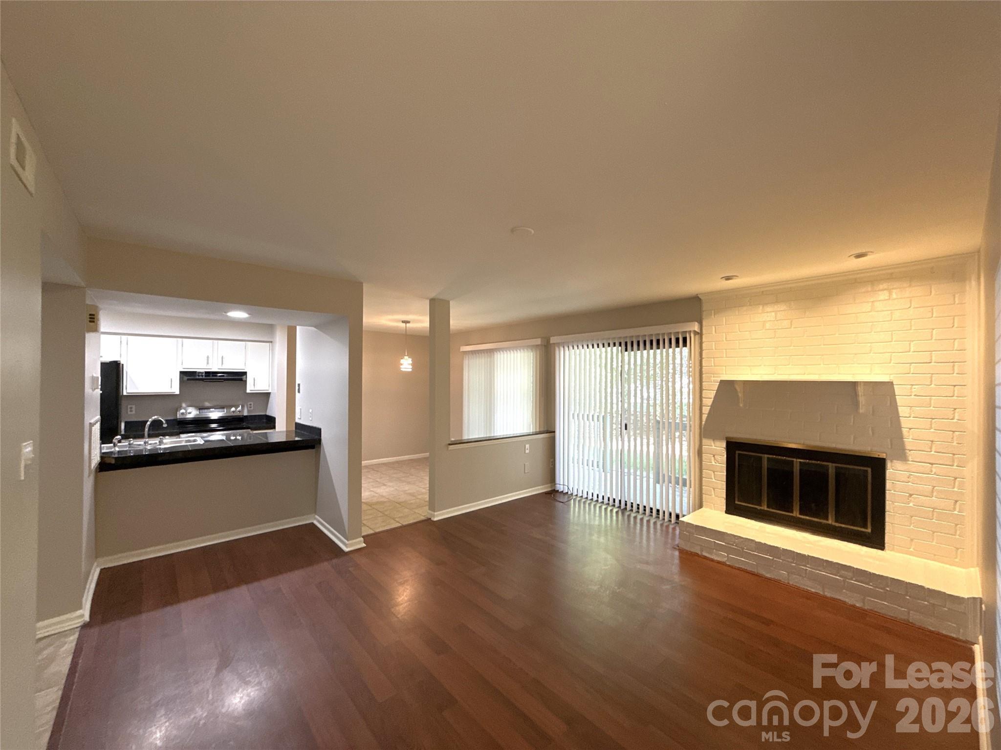 11002 Harrowfield Road Charlotte, NC 28226 - Photo 2 of 16 a kitchen with a stove and a white cabinets