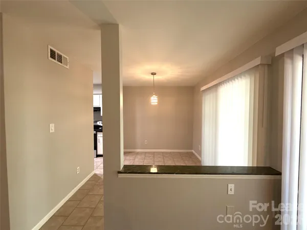 a kitchen with stainless steel appliances a stove a sink a microwave a refrigerator and cabinets