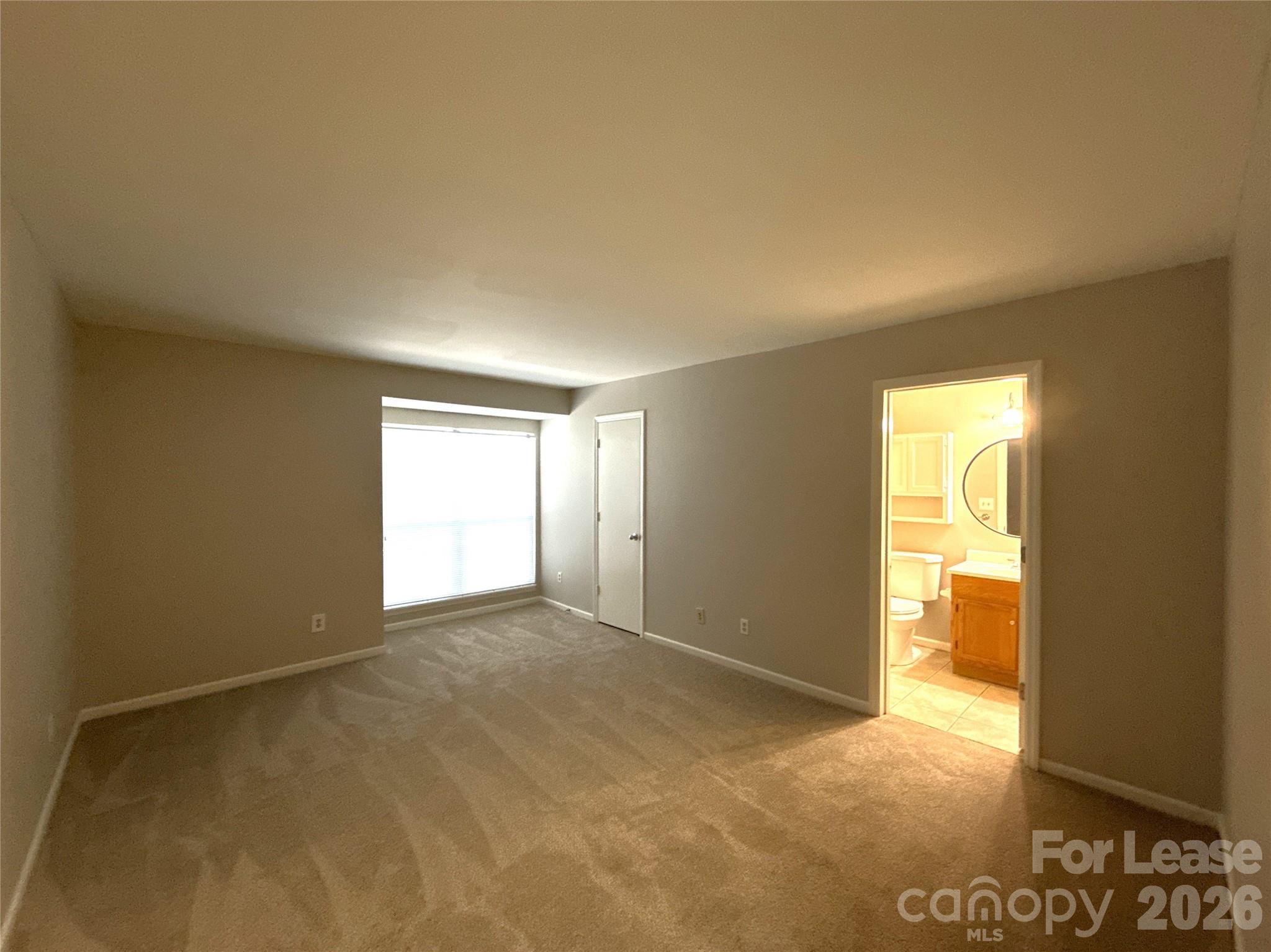 11002 Harrowfield Road Charlotte, NC 28226 - Photo 10 of 16 a view of an empty room and a window