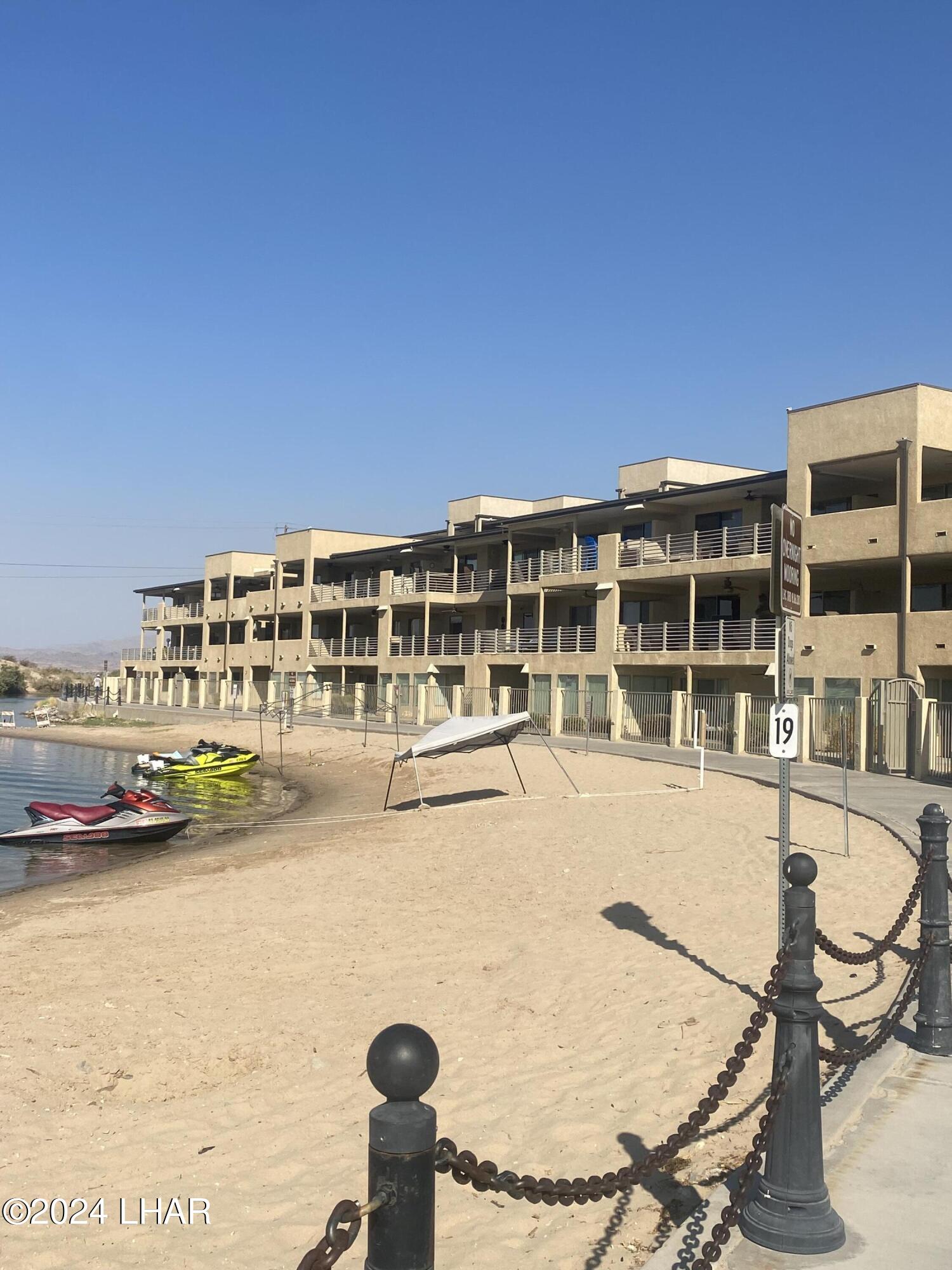 94 London Bridge Road, Unit 108 Lake Havasu City, AZ 86403 - Photo 2 of 38 a view of a swimming pool with outdoor seating