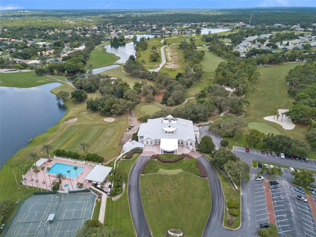 10081 Georgetown Court Weeki Wachee, FL 34613 - Photo 60 of 76 an aerial view of a house with outdoor space swimming pool and lake view