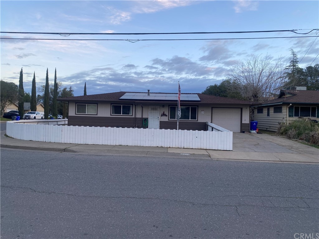 1040 Franzel Road Red Bluff, CA 96080 - Photo 1 of 1 a front view of a house with a garden