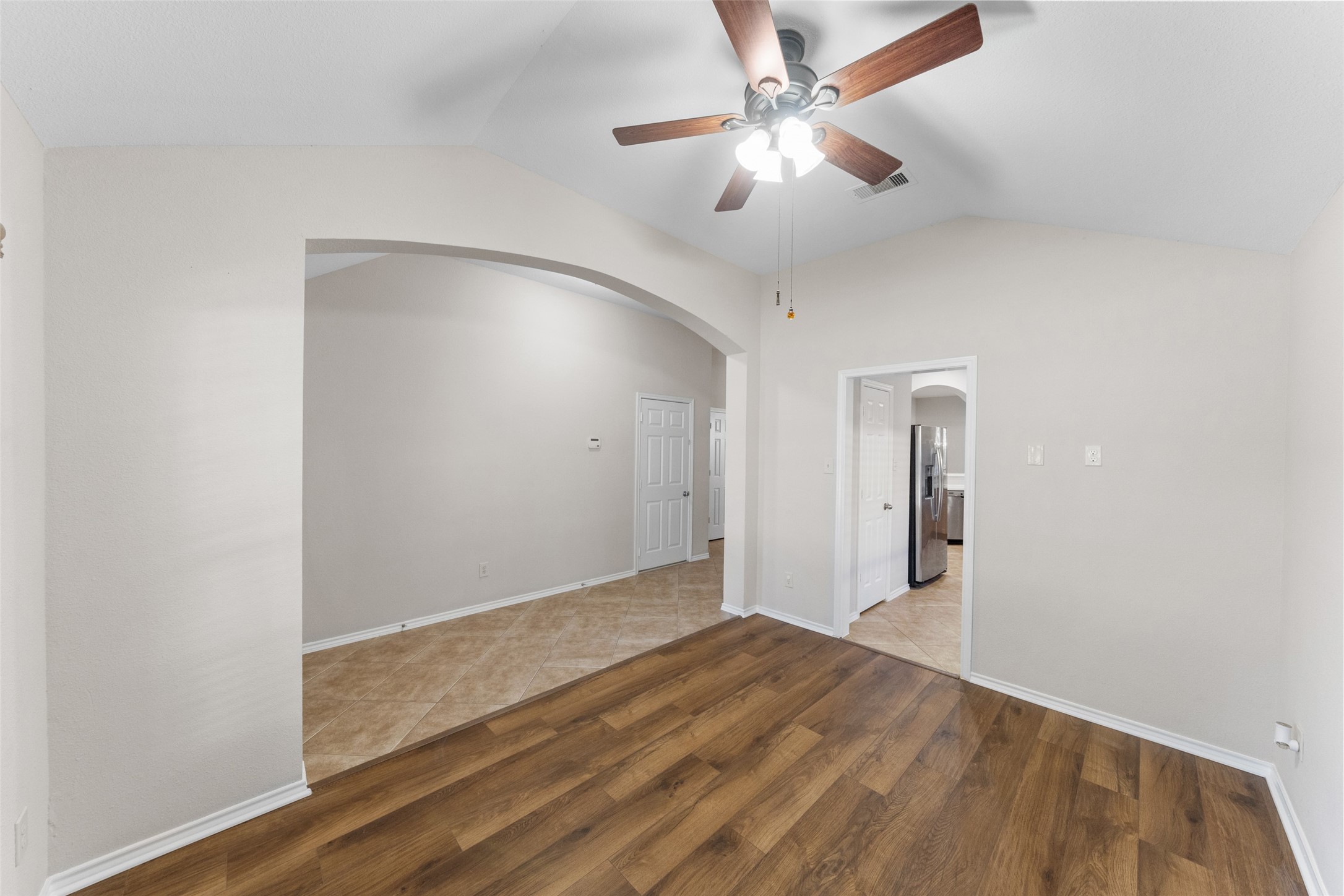 2443 Morgan Ridge Lane Spring, TX 77386 - Photo 11 of 26 an empty room with fan and a ceiling fan