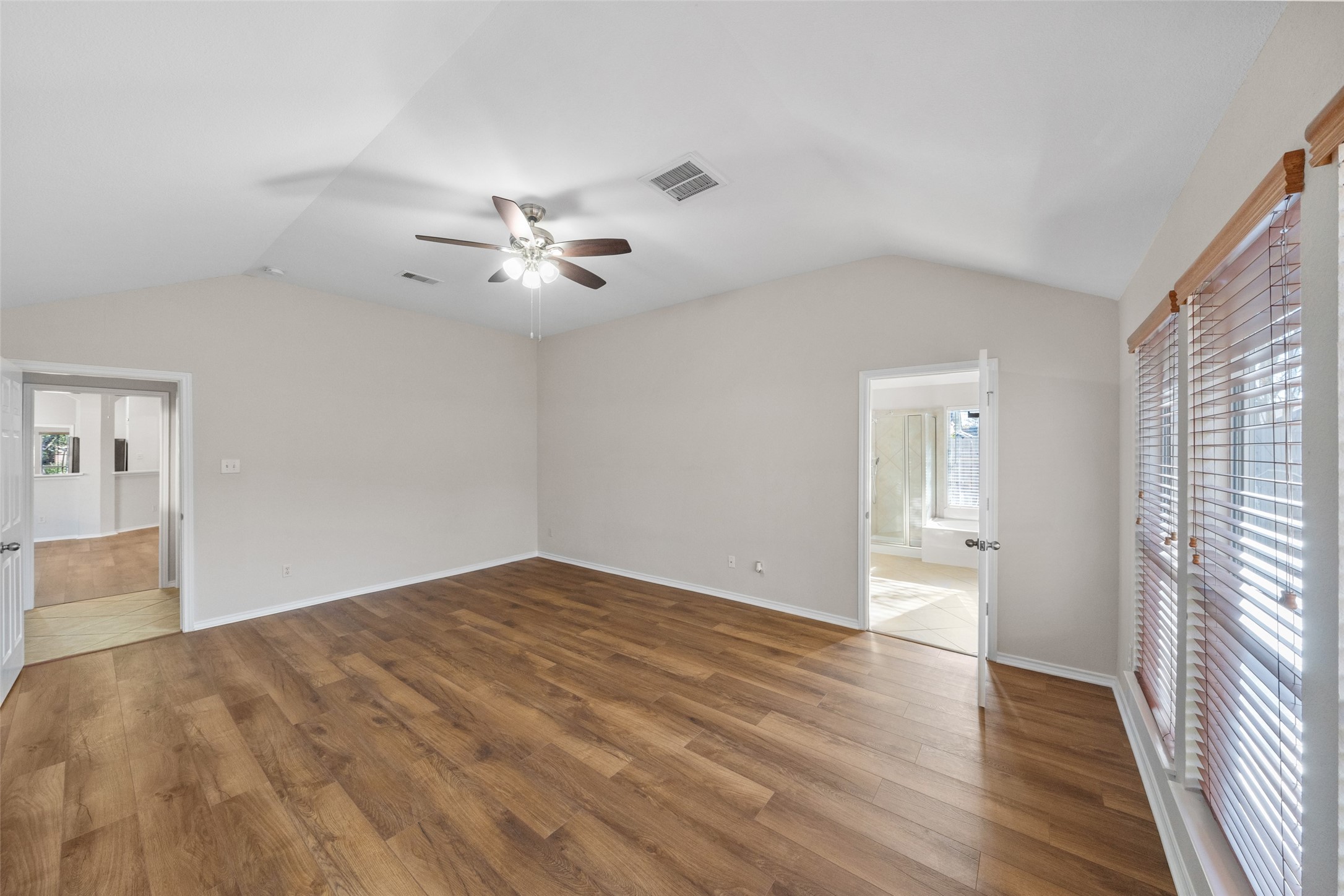 2443 Morgan Ridge Lane Spring, TX 77386 - Photo 16 of 26 wooden floor in an empty room with a window