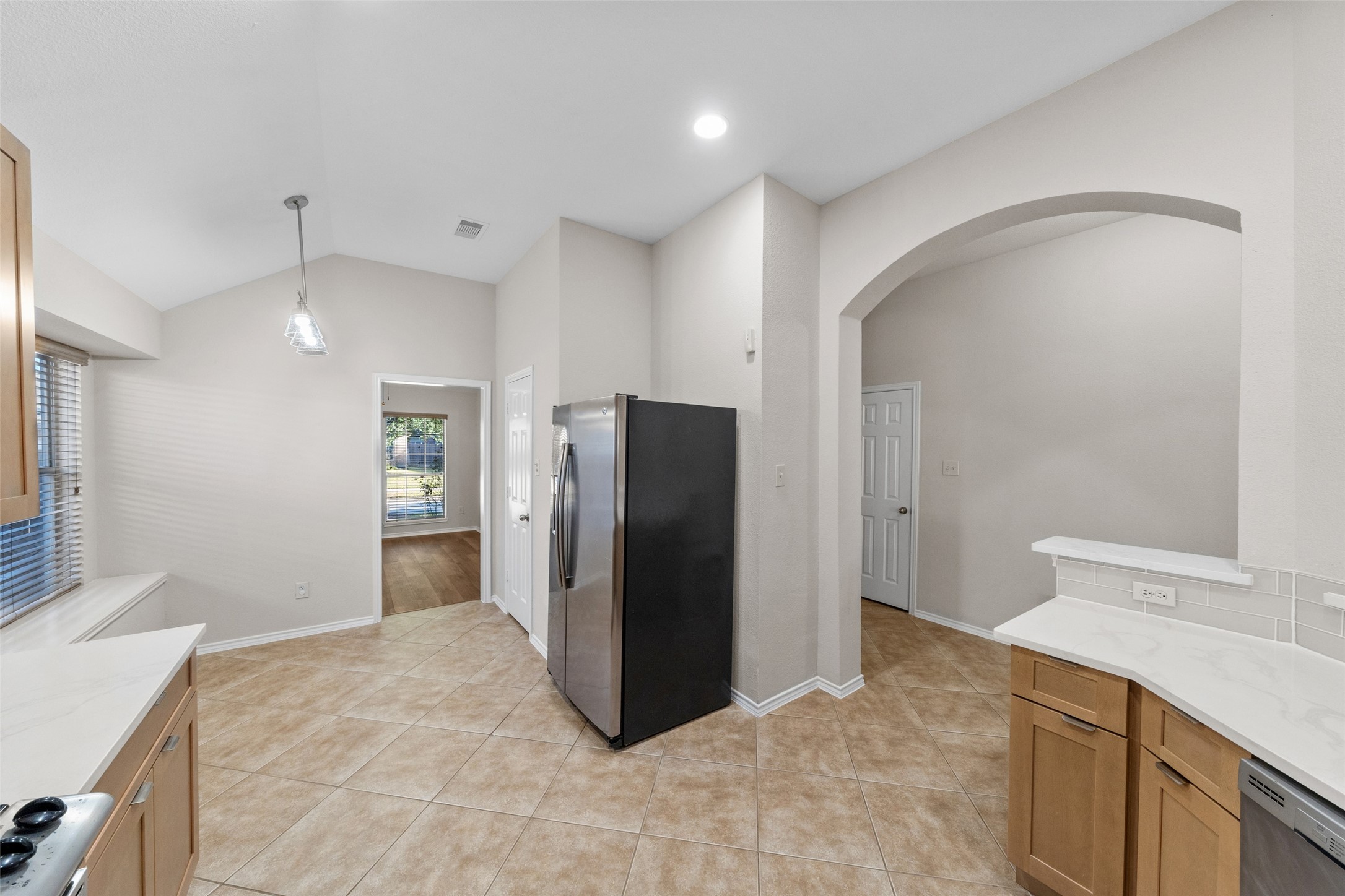 2443 Morgan Ridge Lane Spring, TX 77386 - Photo 4 of 26 a kitchen with a refrigerator and a sink